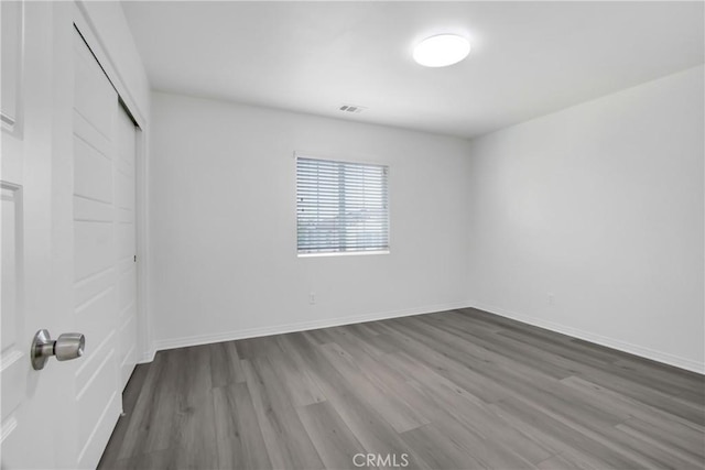 13153 Stanton Dr, Rancho Cucamonga, CA 91739 - unfurnished bedroom with wood finished floors, a closet, and baseboards