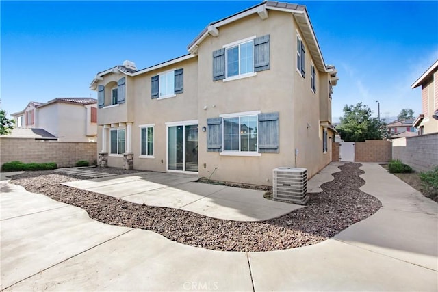 13153 Stanton Dr, Rancho Cucamonga, CA 91739 - rear view of house featuring cooling unit, a patio area, a fenced backyard, and stucco siding