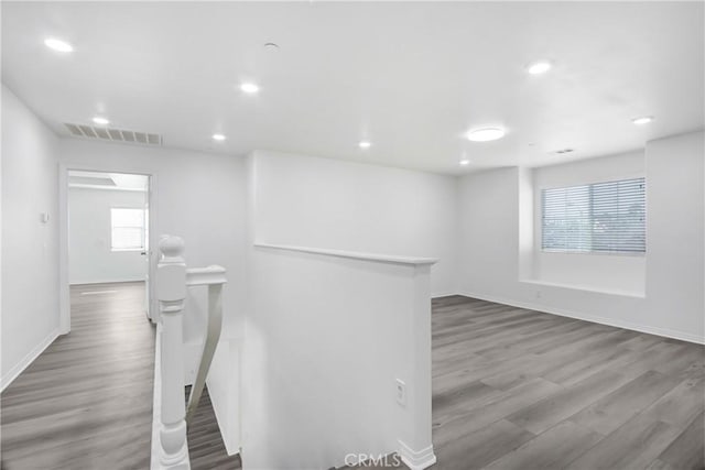13153 Stanton Dr, Rancho Cucamonga, CA 91739 - corridor featuring an upstairs landing, wood finished floors, healthy amount of natural light, and recessed lighting