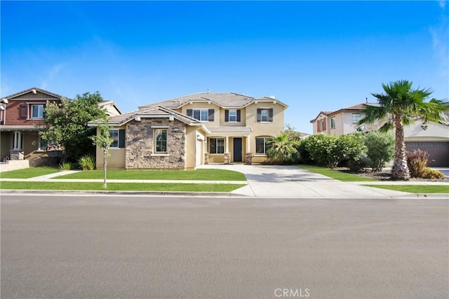 13153 Stanton Dr, Rancho Cucamonga, CA 91739 - view of front facade with stone siding, driveway, stucco siding, and a front yard
