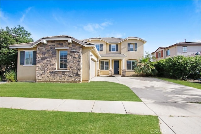 13153 Stanton Dr, Rancho Cucamonga, CA 91739 - view of front facade featuring driveway, stone siding, stucco siding, a front yard, and a garage