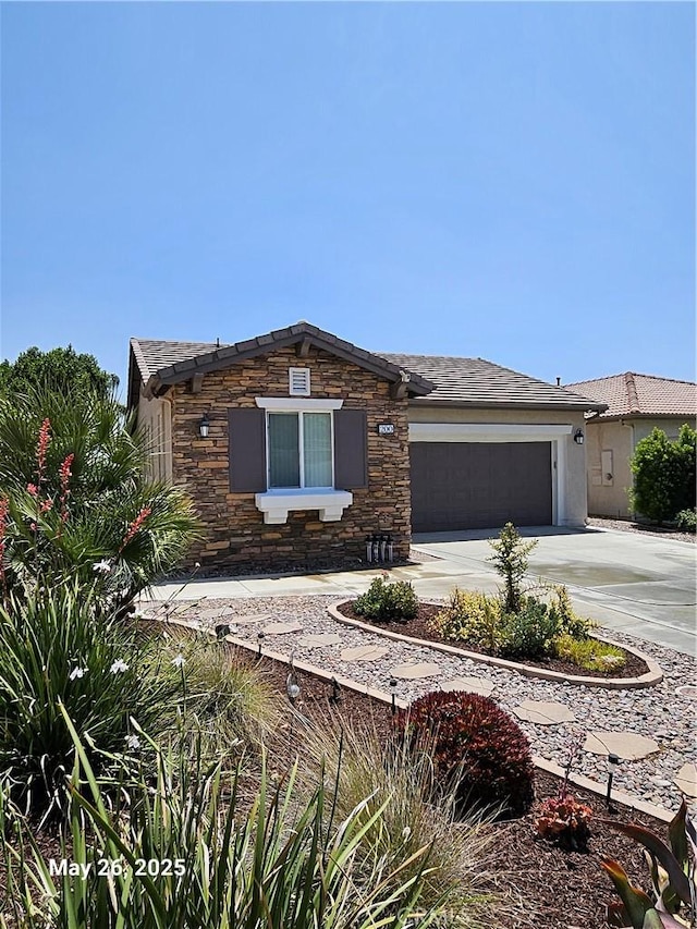 200 Janzen Way, Hemet, CA 92545 - view of front of property with concrete driveway, an attached garage, and stone siding