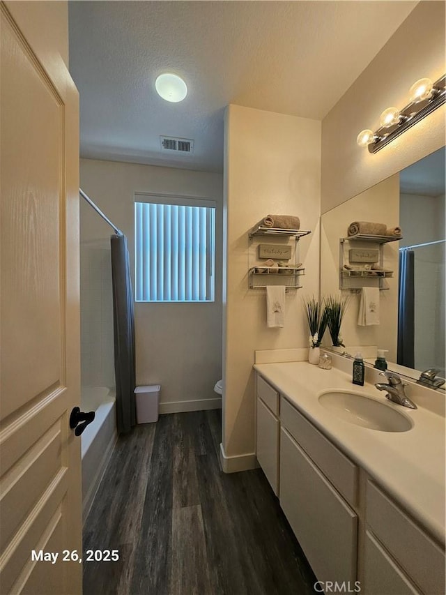 200 Janzen Way, Hemet, CA 92545 - full bath with vanity, wood finished floors, shower / bath combo with shower curtain, and a textured ceiling