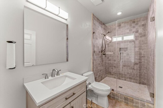 2189 Myers St, Riverside, CA 92503 - full bathroom featuring vanity, a stall shower, toilet, and recessed lighting