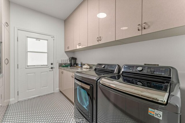 2189 Myers St, Riverside, CA 92503 - laundry area featuring cabinet space, washer and dryer, baseboards, and light floors