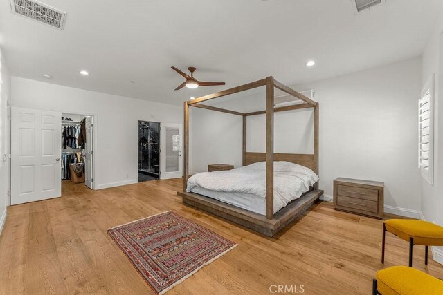 2189 Myers St, Riverside, CA 92503 - bedroom with light wood-style flooring, baseboards, a spacious closet, recessed lighting, and a closet