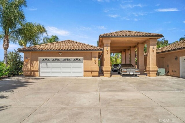2189 Myers St, Riverside, CA 92503 - mediterranean / spanish-style house with a tile roof, stucco siding, and driveway