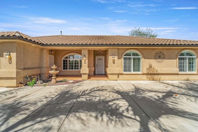 2189 Myers St, Riverside, CA 92503 - mediterranean / spanish-style house featuring a tile roof and stucco siding
