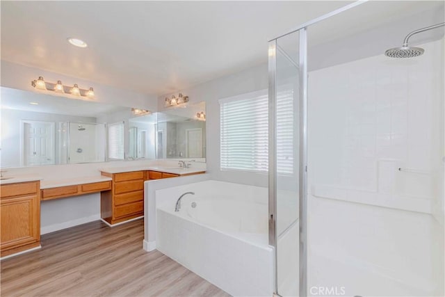 9135 W Rancho Park Cir, Rancho Cucamonga, CA 91730 - full bath featuring a stall shower, vanity, a bath, and wood finished floors