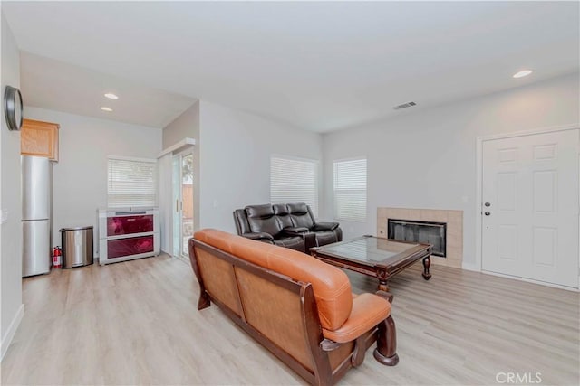 9135 W Rancho Park Cir, Rancho Cucamonga, CA 91730 - living room featuring light wood-style floors, a fireplace, and recessed lighting