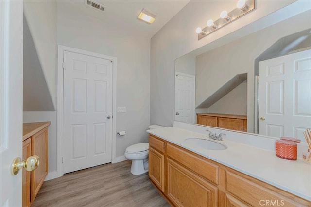 9135 W Rancho Park Cir, Rancho Cucamonga, CA 91730 - bathroom with vanity, toilet, wood finished floors, and baseboards