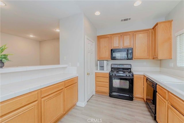 9135 W Rancho Park Cir, Rancho Cucamonga, CA 91730 - kitchen featuring black appliances, light wood finished floors, recessed lighting, and light brown cabinets