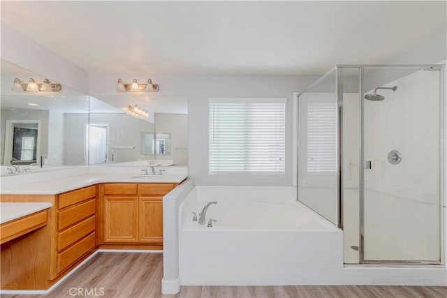 9135 W Rancho Park Cir, Rancho Cucamonga, CA 91730 - bathroom featuring a stall shower, double vanity, and a bath