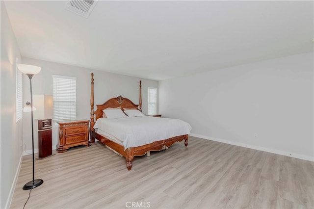 9135 W Rancho Park Cir, Rancho Cucamonga, CA 91730 - bedroom with light wood-style flooring, multiple windows, and baseboards