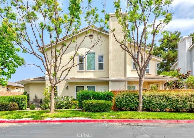 9135 W Rancho Park Cir, Rancho Cucamonga, CA 91730 - view of front of home with stucco siding and a chimney