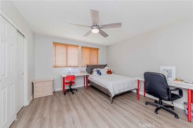9135 W Rancho Park Cir, Rancho Cucamonga, CA 91730 - bedroom featuring wood finished floors, a closet, a desk, and baseboards