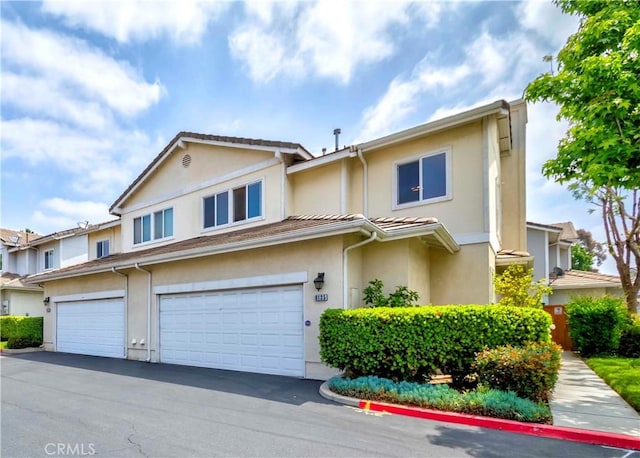9135 W Rancho Park Cir, Rancho Cucamonga, CA 91730 - view of property with stucco siding and a garage