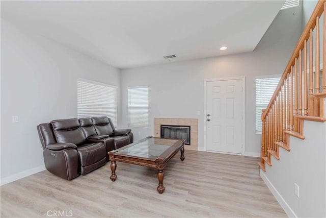9135 W Rancho Park Cir, Rancho Cucamonga, CA 91730 - living area featuring stairs, baseboards, light wood-style floors, a fireplace, and recessed lighting
