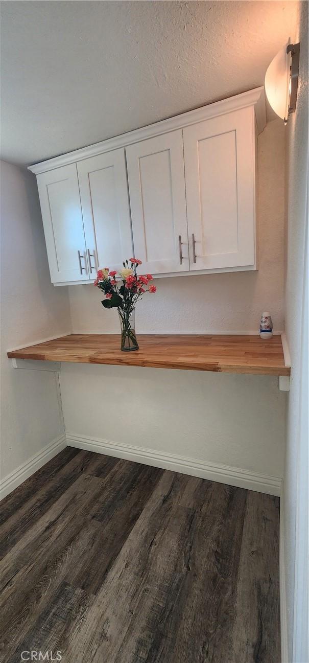 5818 Tyler St, Riverside, CA 92503 - detailed view of baseboards and wood finished floors
