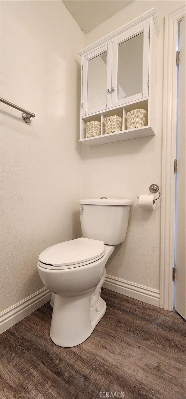 5818 Tyler St, Riverside, CA 92503 - bathroom with baseboards, toilet, and wood finished floors