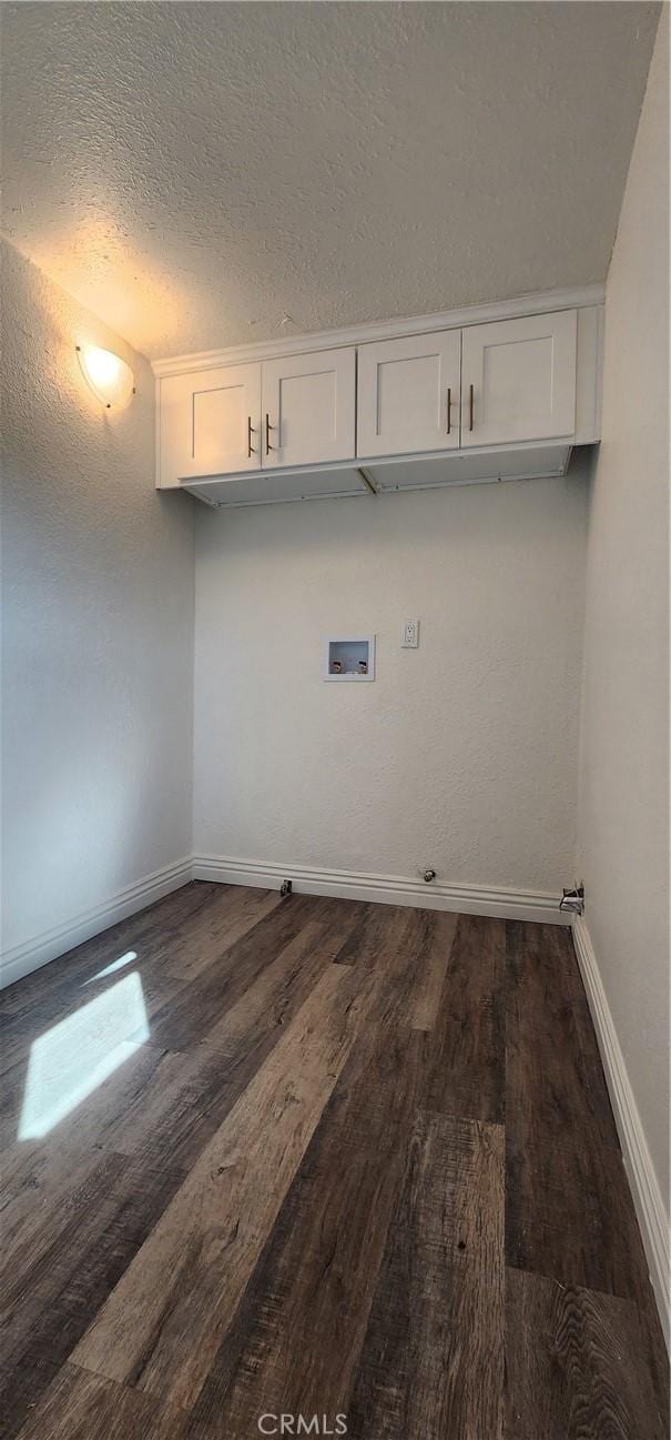 5818 Tyler St, Riverside, CA 92503 - laundry area with cabinet space, washer hookup, dark wood-style floors, baseboards, and a textured ceiling
