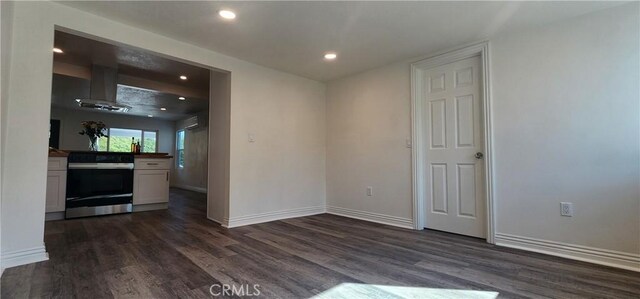 5818 Tyler St, Riverside, CA 92503 - unfurnished dining area with dark wood-style flooring, recessed lighting, and baseboards