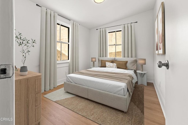 5333 Monte Vista St, Highland Park, CA 90042 - bedroom featuring light wood-style flooring, vaulted ceiling, and baseboards