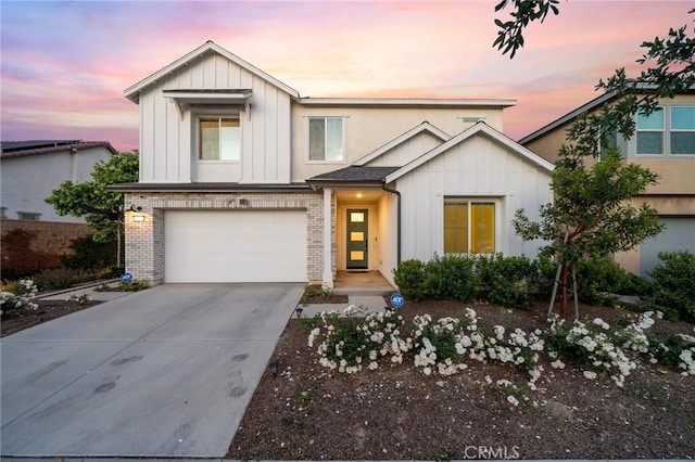 4745 S Mae Way, Ontario, CA 91762 - view of front of house featuring board and batten siding, concrete driveway, an attached garage, and brick siding