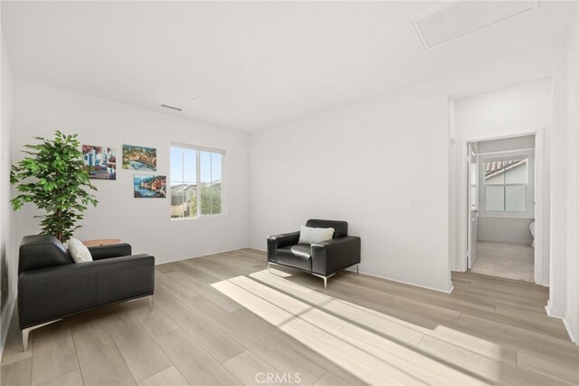 4745 S Mae Way, Ontario, CA 91762 - living area with light wood-style flooring and attic access