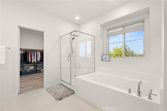 4745 S Mae Way, Ontario, CA 91762 - bathroom featuring a garden tub, a shower stall, a walk in closet, baseboards, and recessed lighting