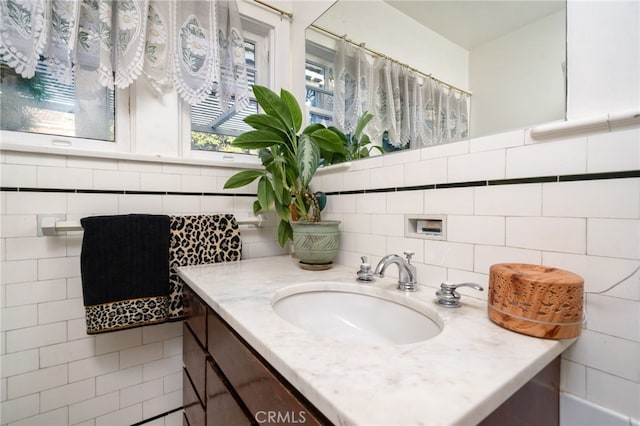125 W 11th St, Claremont, CA 91711 - bathroom with vanity, tile walls, and tasteful backsplash