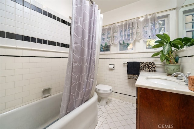 125 W 11th St, Claremont, CA 91711 - bathroom with vanity, tile walls, tile patterned floors, shower / bathtub combination with curtain, and toilet