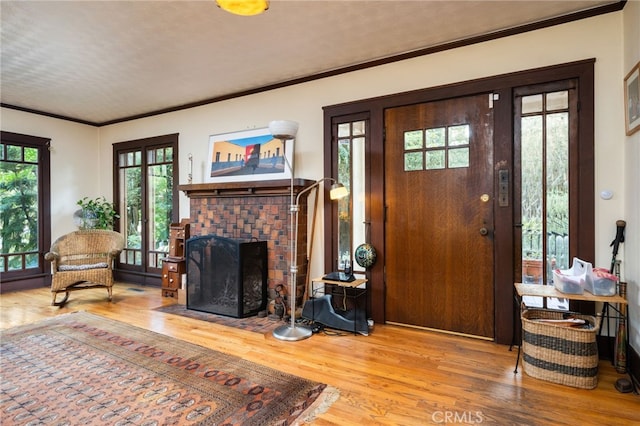 125 W 11th St, Claremont, CA 91711 - living area featuring wood finished floors, ornamental molding, and a fireplace