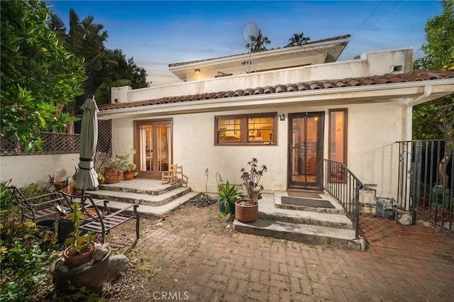 125 W 11th St, Claremont, CA 91711 - rear view of property with stucco siding, french doors, and a tiled roof