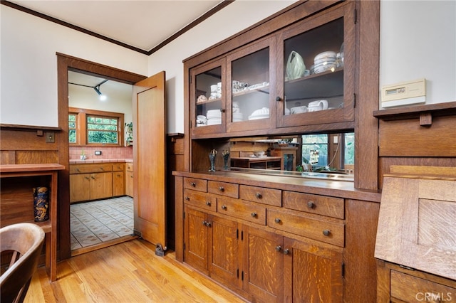 125 W 11th St, Claremont, CA 91711 - bar area with light wood-style floors, ornamental molding, and decorative backsplash