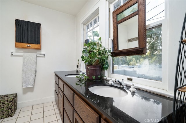 125 W 11th St, Claremont, CA 91711 - full bath featuring plenty of natural light, double vanity, tile patterned flooring, and baseboards