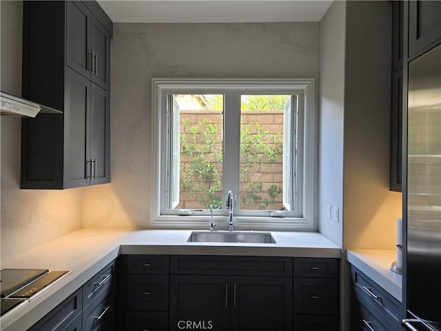 116 Clear Fls, Irvine, CA 92602 - kitchen with a sink, exhaust hood, electric stovetop, and light countertops
