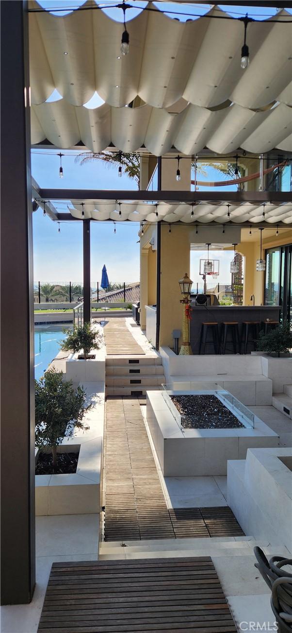 116 Clear Fls, Irvine, CA 92602 - view of patio featuring a fire pit