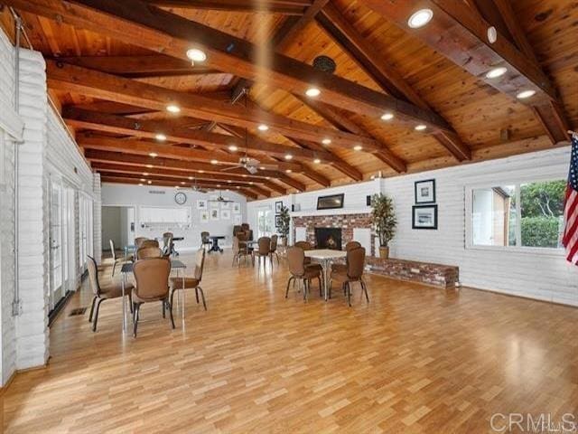 6496 Friendly Pl, Carlsbad, CA 92011 - dining space featuring wood finished floors, wooden ceiling, and a fireplace