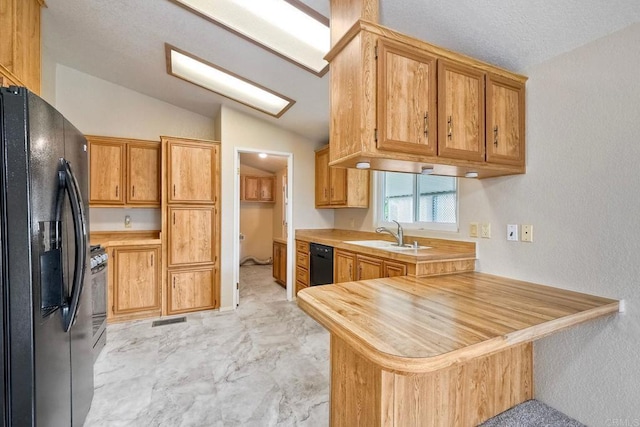 6496 Friendly Pl, Carlsbad, CA 92011 - kitchen featuring black appliances, a sink, a peninsula, lofted ceiling, and wooden counters
