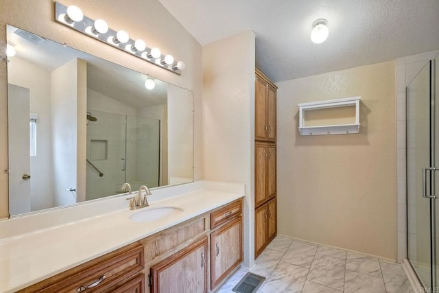 6496 Friendly Pl, Carlsbad, CA 92011 - bathroom with a shower stall, vanity, marble finish floors, and lofted ceiling