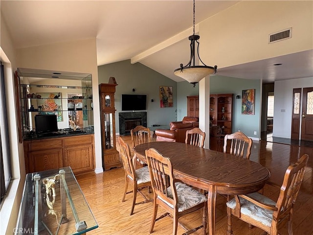 12070 Rideout Way, Whittier, CA 90601 - dining space with light wood-style flooring and a fireplace