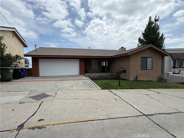12070 Rideout Way, Whittier, CA 90601 - ranch-style home with driveway, a garage, stucco siding, and a front lawn