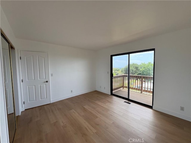 12070 Rideout Way, Whittier, CA 90601 - empty room featuring light wood-style floors and baseboards