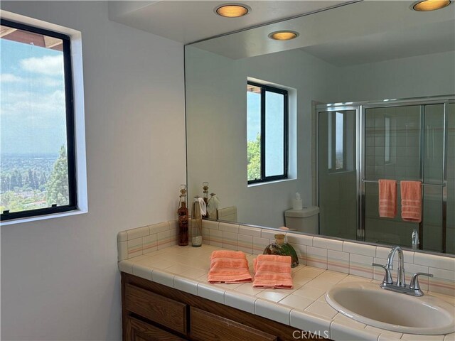 12070 Rideout Way, Whittier, CA 90601 - full bathroom featuring vanity, a shower with shower door, and recessed lighting