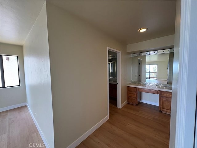 12070 Rideout Way, Whittier, CA 90601 - hallway featuring light wood-type flooring, a desk, baseboards, and recessed lighting