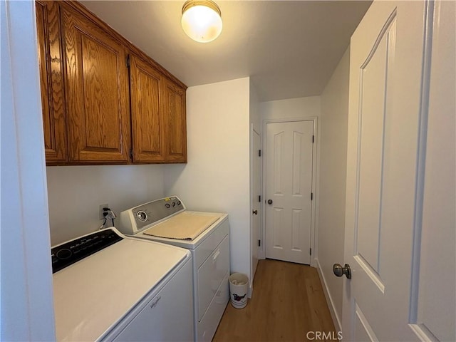 12070 Rideout Way, Whittier, CA 90601 - washroom featuring washing machine and dryer, light wood finished floors, cabinet space, and baseboards
