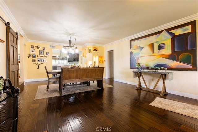 724 Forestview Ave, La Puente, CA 91746 - dining room with a barn door, hardwood / wood-style flooring, baseboards, and crown molding
