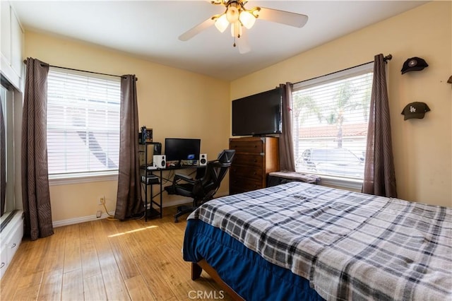 724 Forestview Ave, La Puente, CA 91746 - bedroom with light wood-type flooring, multiple windows, baseboards, and a ceiling fan
