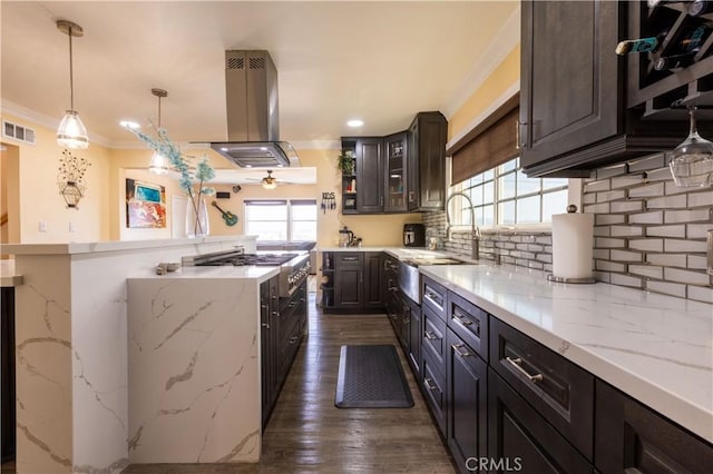 724 Forestview Ave, La Puente, CA 91746 - kitchen with island range hood, a sink, crown molding, stovetop, and backsplash